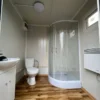 Container Sanitario 2x2m con Ducha y Depósito de Agua